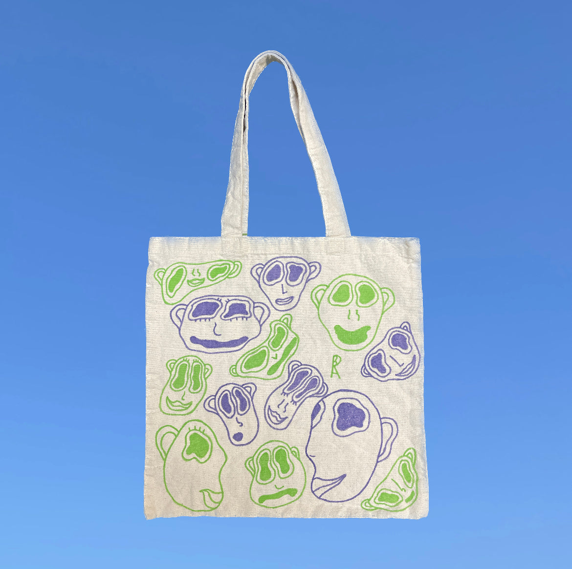 Faces Tote Bag