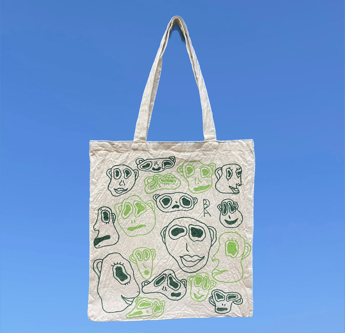 Faces Tote Bag