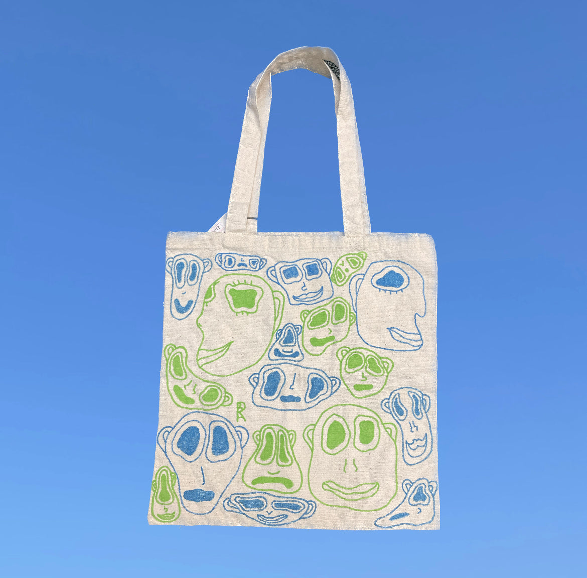 Faces Tote Bag