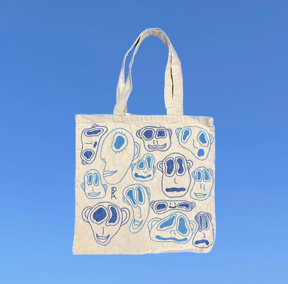 Faces Tote Bag