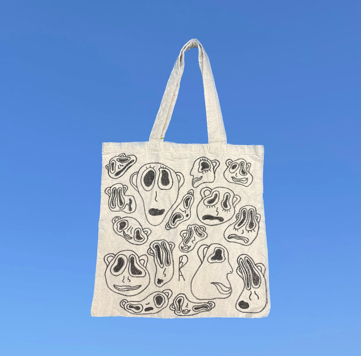 Faces Tote Bag